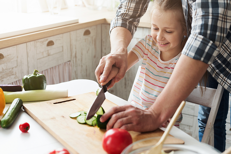 Child Helping Prepare Dinner