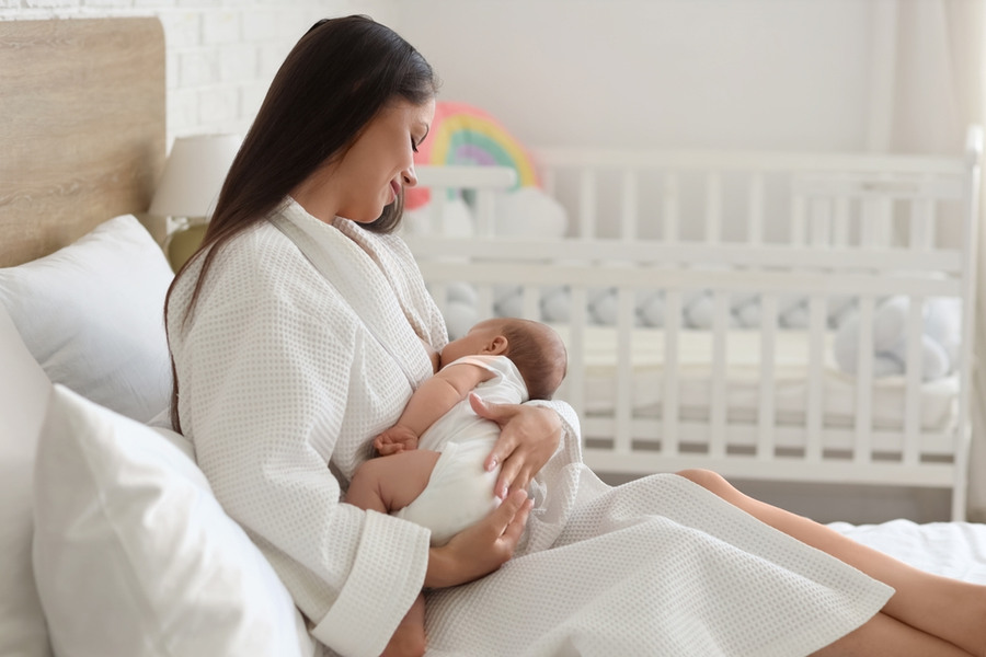 Happy mum breast feeding