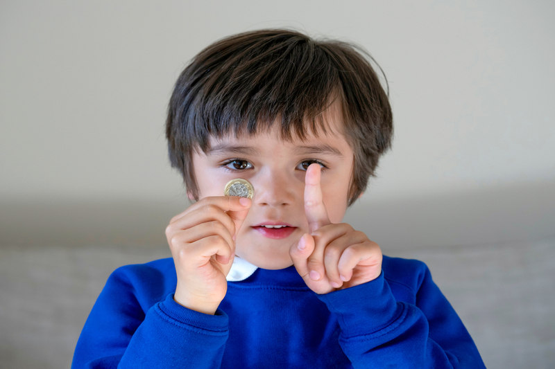 School Boy Holding Coin